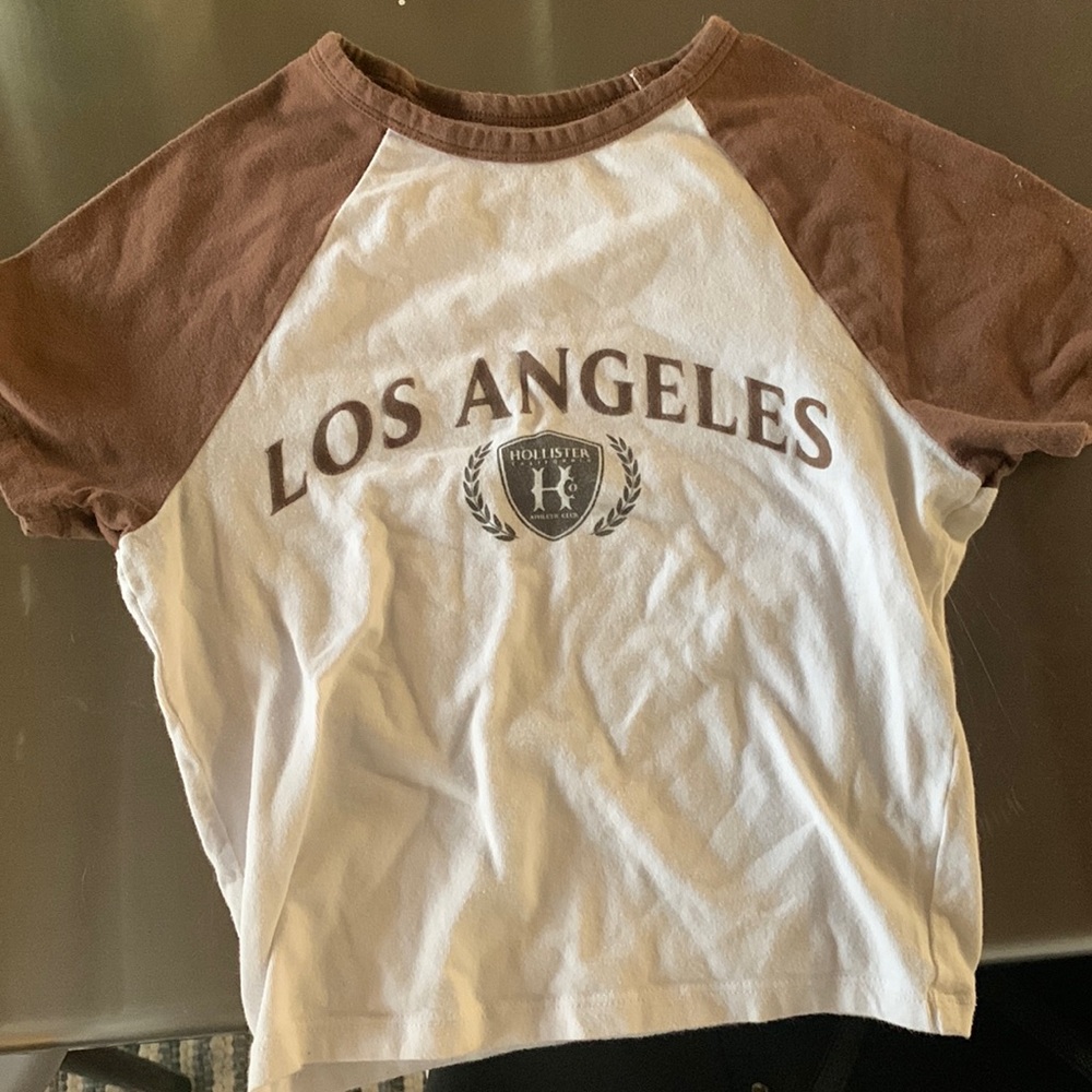 Brown also Angelo’s Hollister Baby Tee